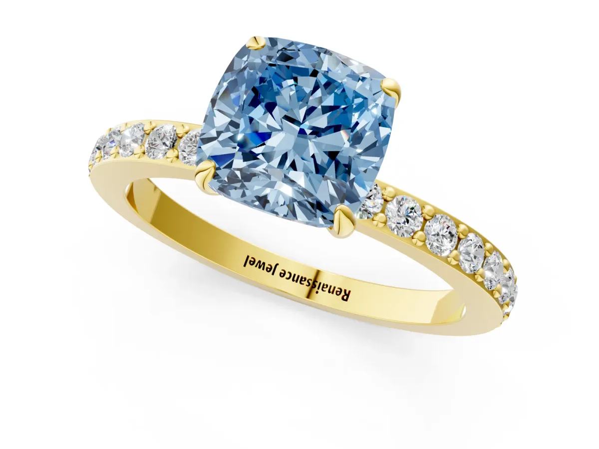 Fancy Blue Cushion Cut Diamond Solitaire Engagement Ring with Pavé Band and Four-Prong Setting Yellow gold