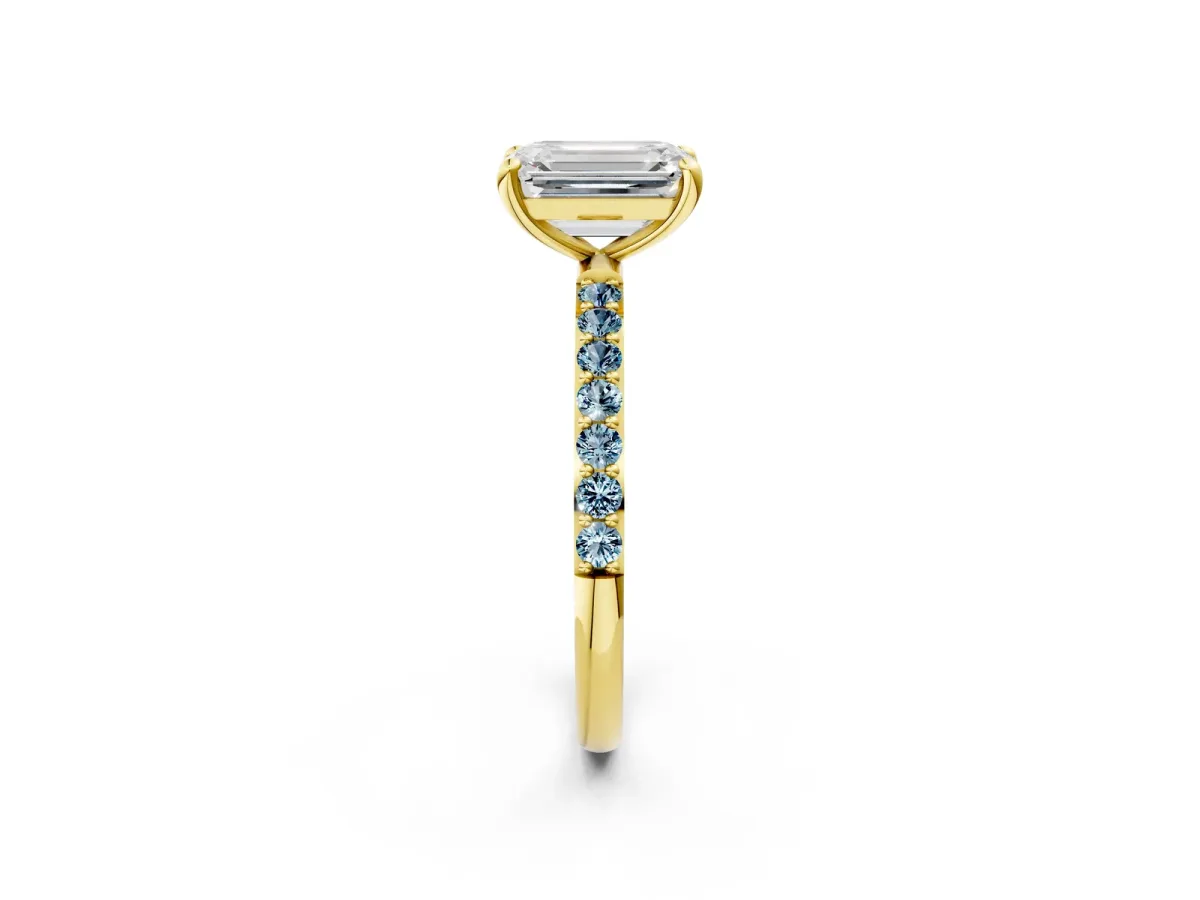 Emerald Cut Diamond Solitaire Ring with Round Aquamarine Pavé Band and Prong Setting Yellow gold