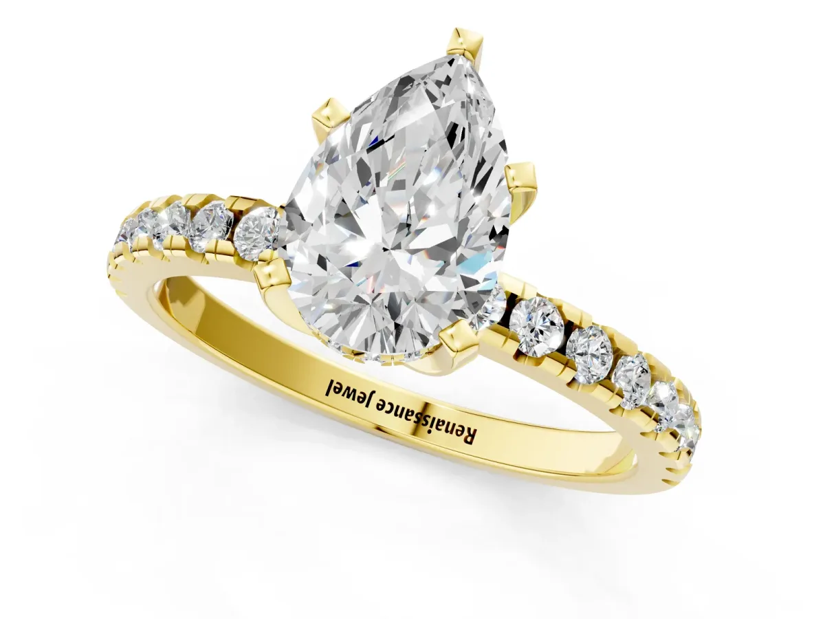 Pear Cut Diamond Solitaire Ring with Round Pavé Band and Four-Prong Setting Yellow gold