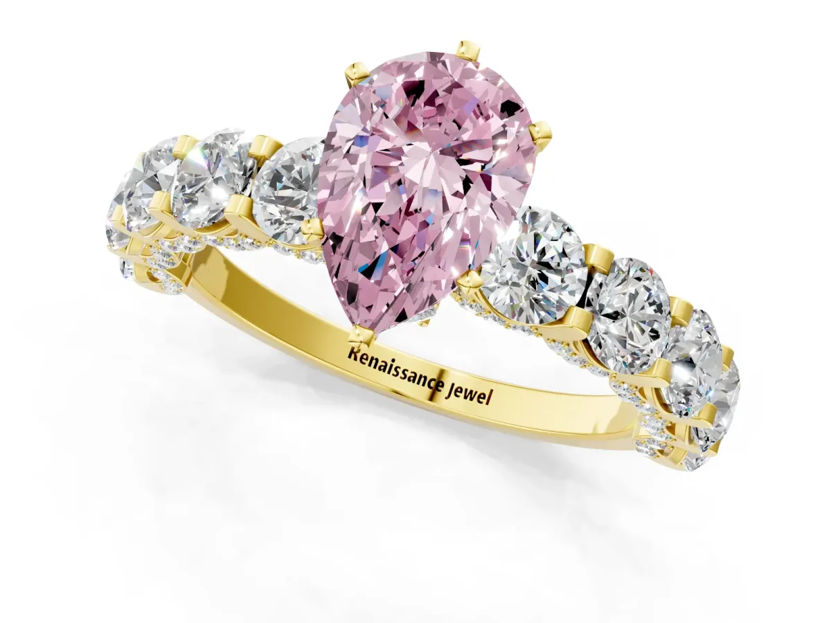 Fancy Pink Pear Cut Diamond Side Stone Engagement Ring with Four-Prong Setting Yellow gold