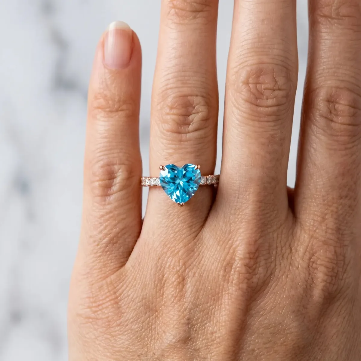 Heart Cut Blue Topaz Solitaire Ring with Round Pavé Band and Four-Prong Setting Rose gold