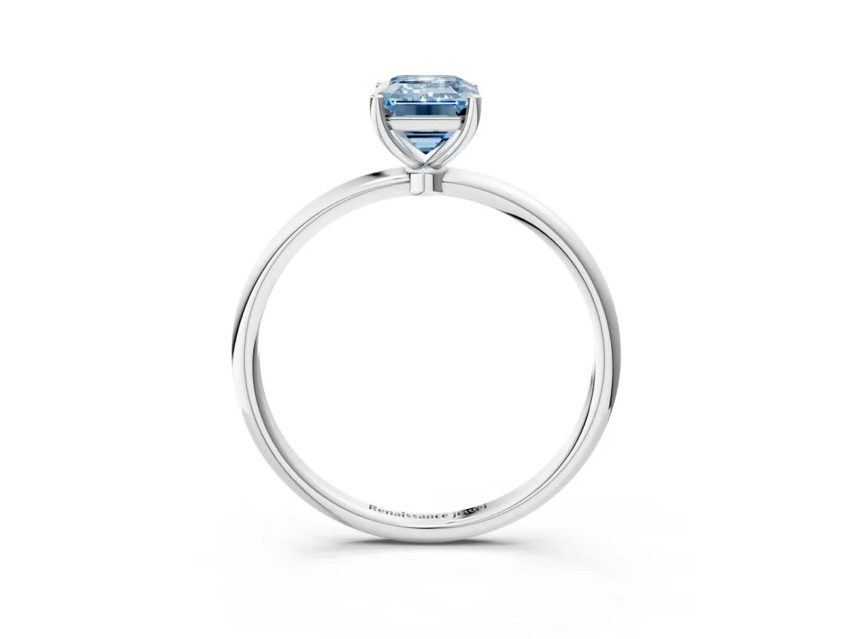 Fancy Blue Emerald Cut Cut Solitaire Engagement Ring with Thin Band and Four-Prong Setting Silver