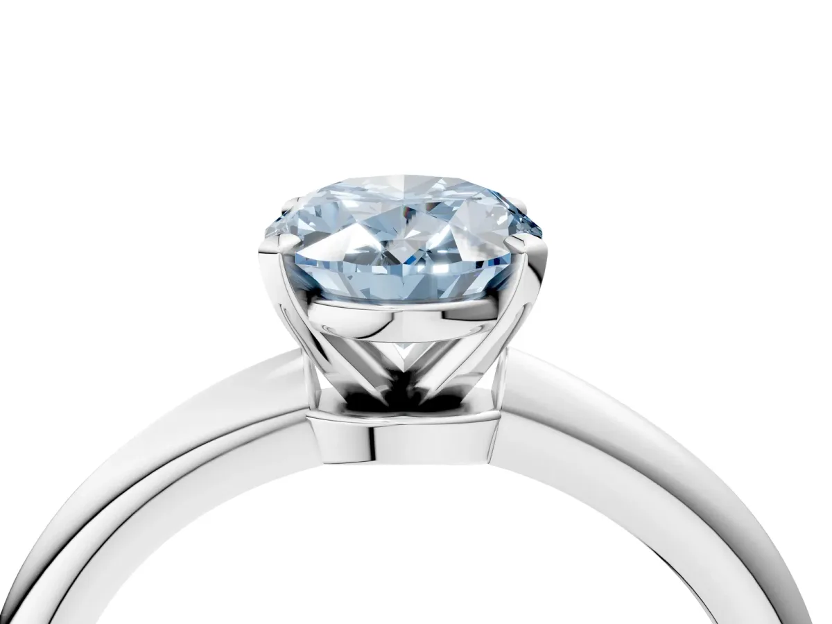 Fancy Blue Oval Cut Diamond Solitaire Ring with Six-Prong Setting and Classic Band Silver