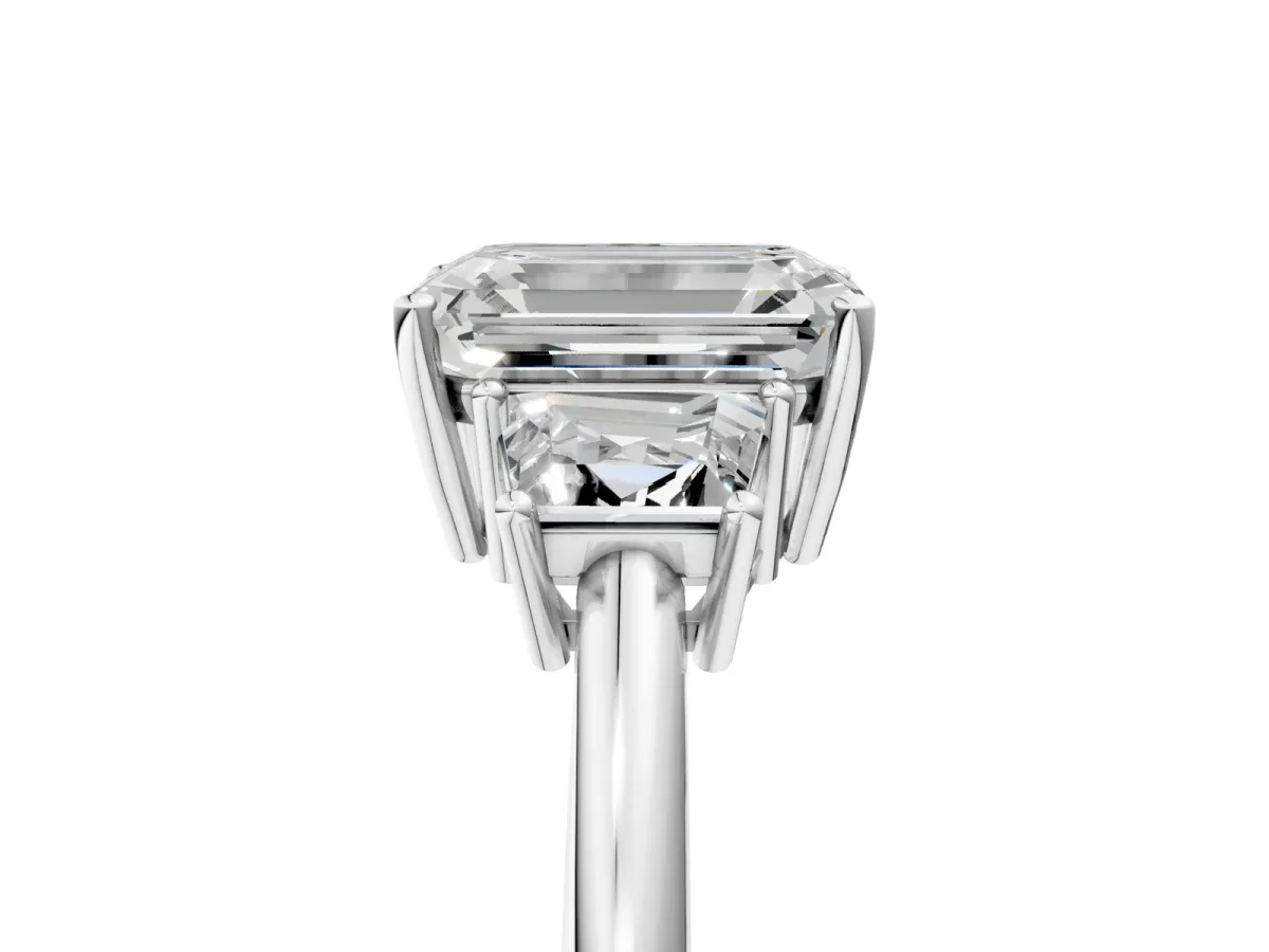 Emerald Cut Diamond Three-Stone Ring with Trapezoid Side Stones and Prong Setting Silver