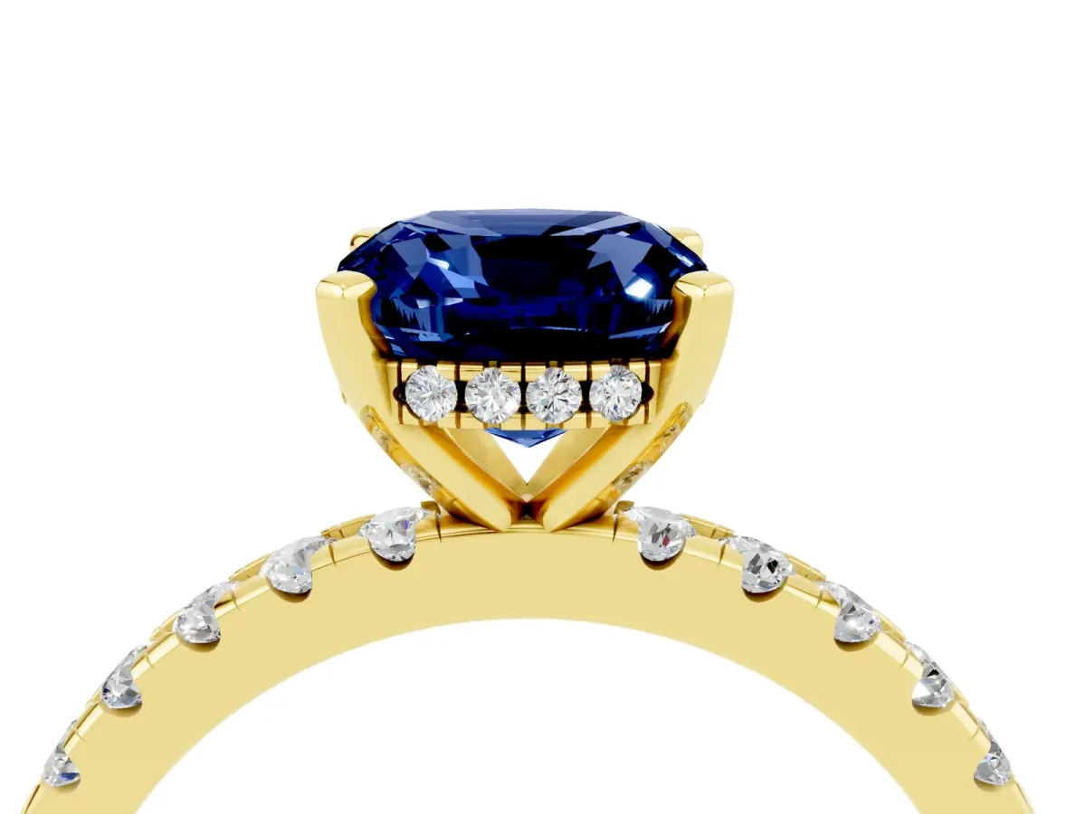Cushion Cut Blue Sapphire Solitaire Ring with Round Pavé Band and Four-Prong Setting Yellow gold