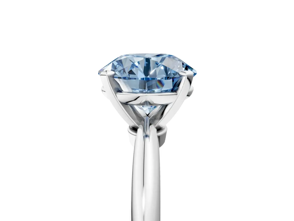 Fancy Blue Round Cut Diamond Solitaire Ring with Six-Prong Setting and Classic Band Platinum
