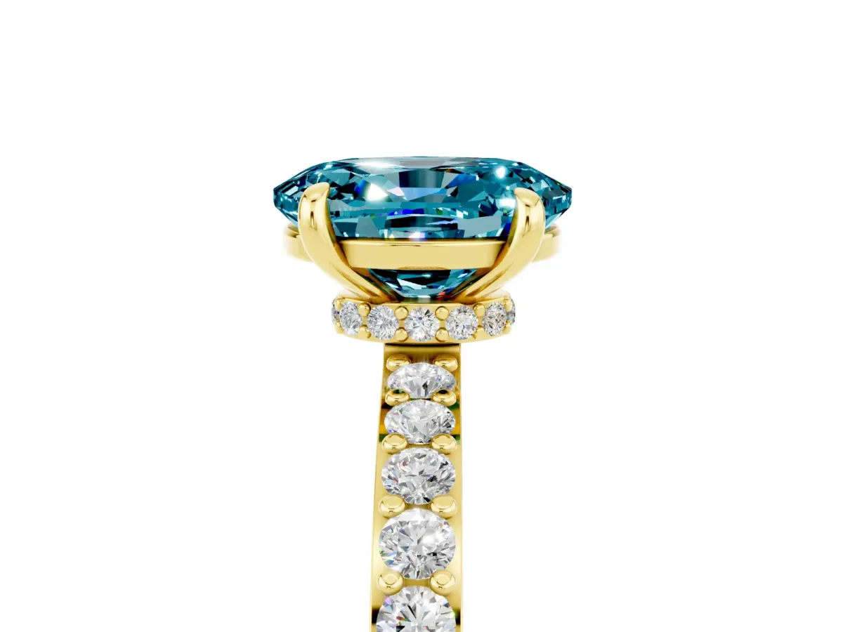 Oval Cut Blue Topaz Solitaire Engagement Ring with Pavé Band and Four-Prong Setting Yellow gold