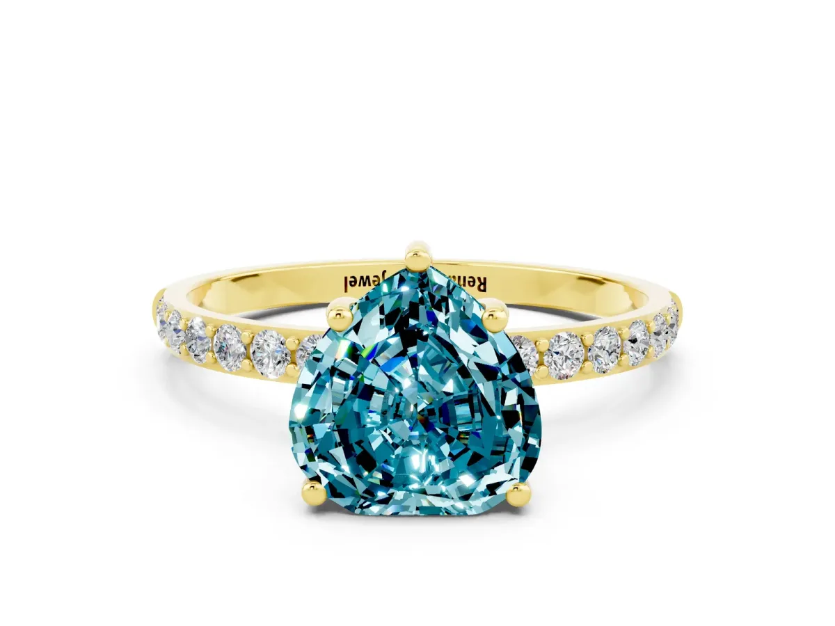Heart Cut Blue Topaz Solitaire Ring with Round Pavé Band and Prong Setting Yellow gold
