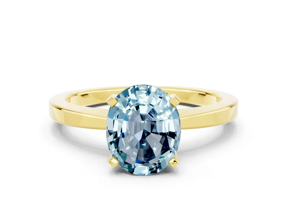 Oval Cut Aquamarine Solitaire Engagement Ring with Classic Band and Four-Prong Setting Yellow gold