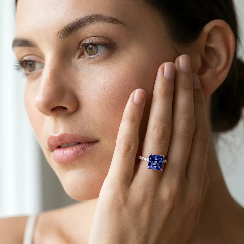 Princess Cut Blue Sapphire Solitaire Ring with Round Pavé Band and Four-Prong Setting Rose gold