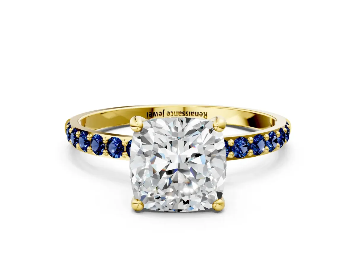 Cushion Cut Diamond Solitaire Ring with Round Blue Sapphire Pavé Band and Prong Setting Yellow gold
