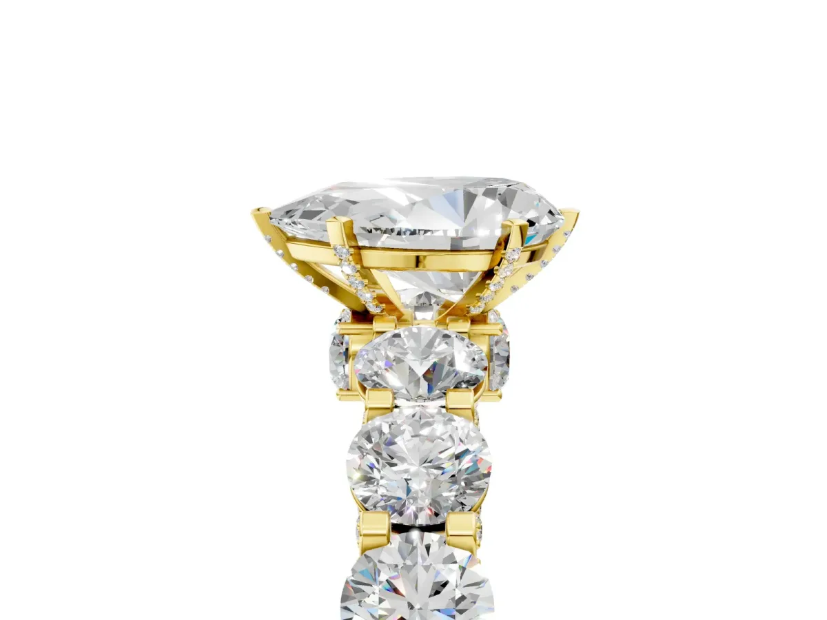 Pear Cut Diamond Side Stone Engagement Ring with Four-Prong Setting Yellow gold