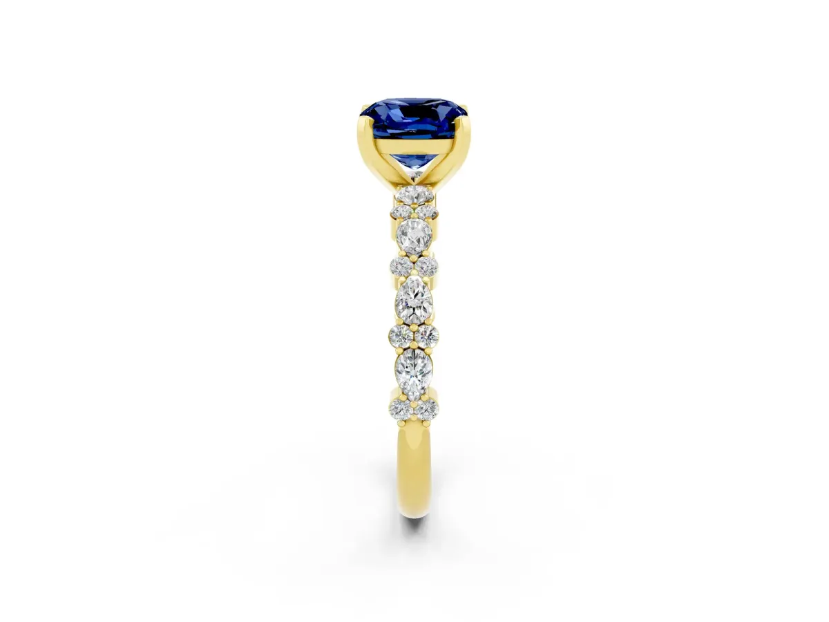 Cushion Cut Blue Sapphire Side Stone Solitaire Ring with Round and Four-Prong Setting Yellow gold