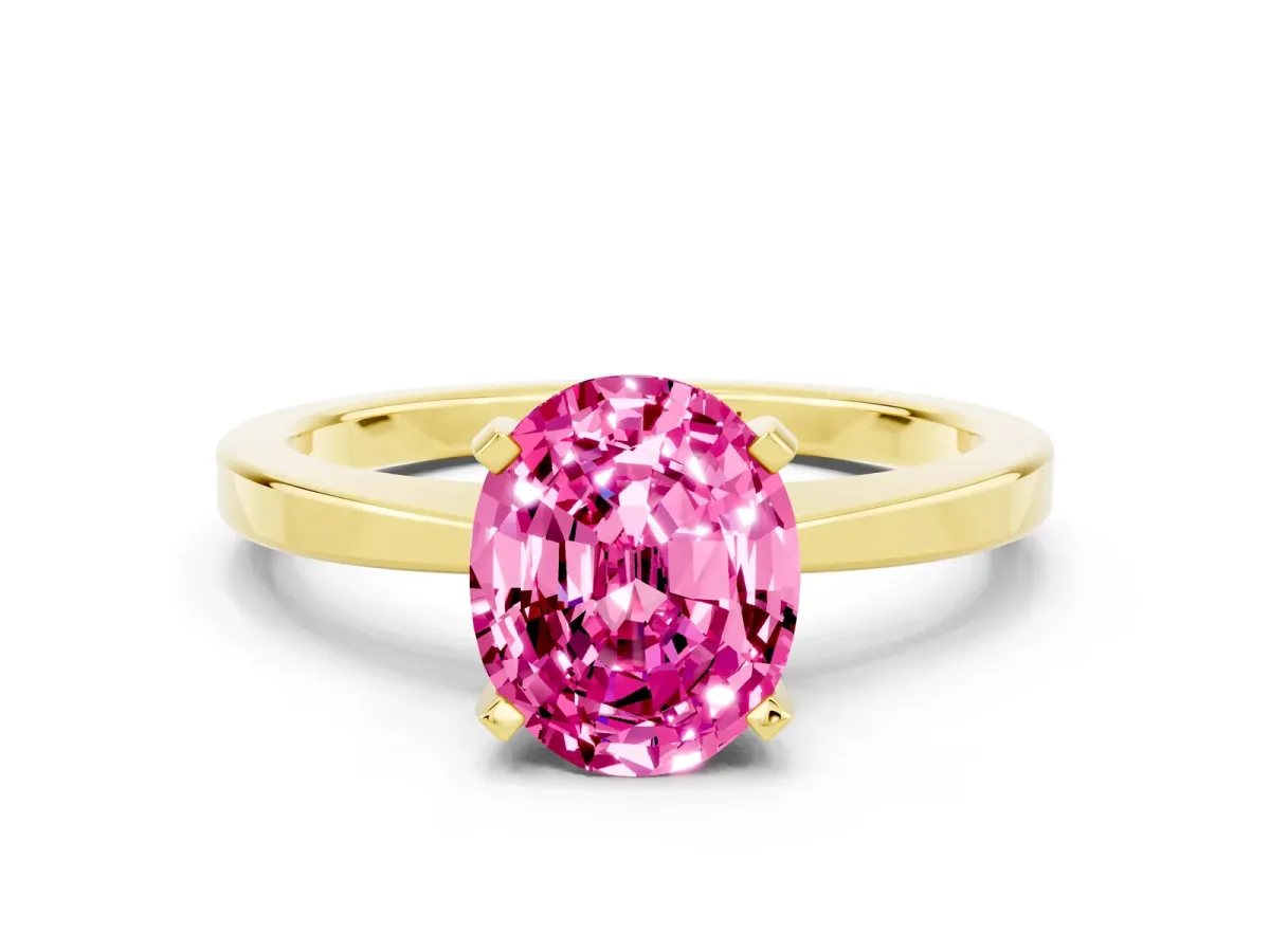 Oval Cut Pink Sapphire Solitaire Engagement Ring with Classic Band and Four-Prong Setting Yellow gold