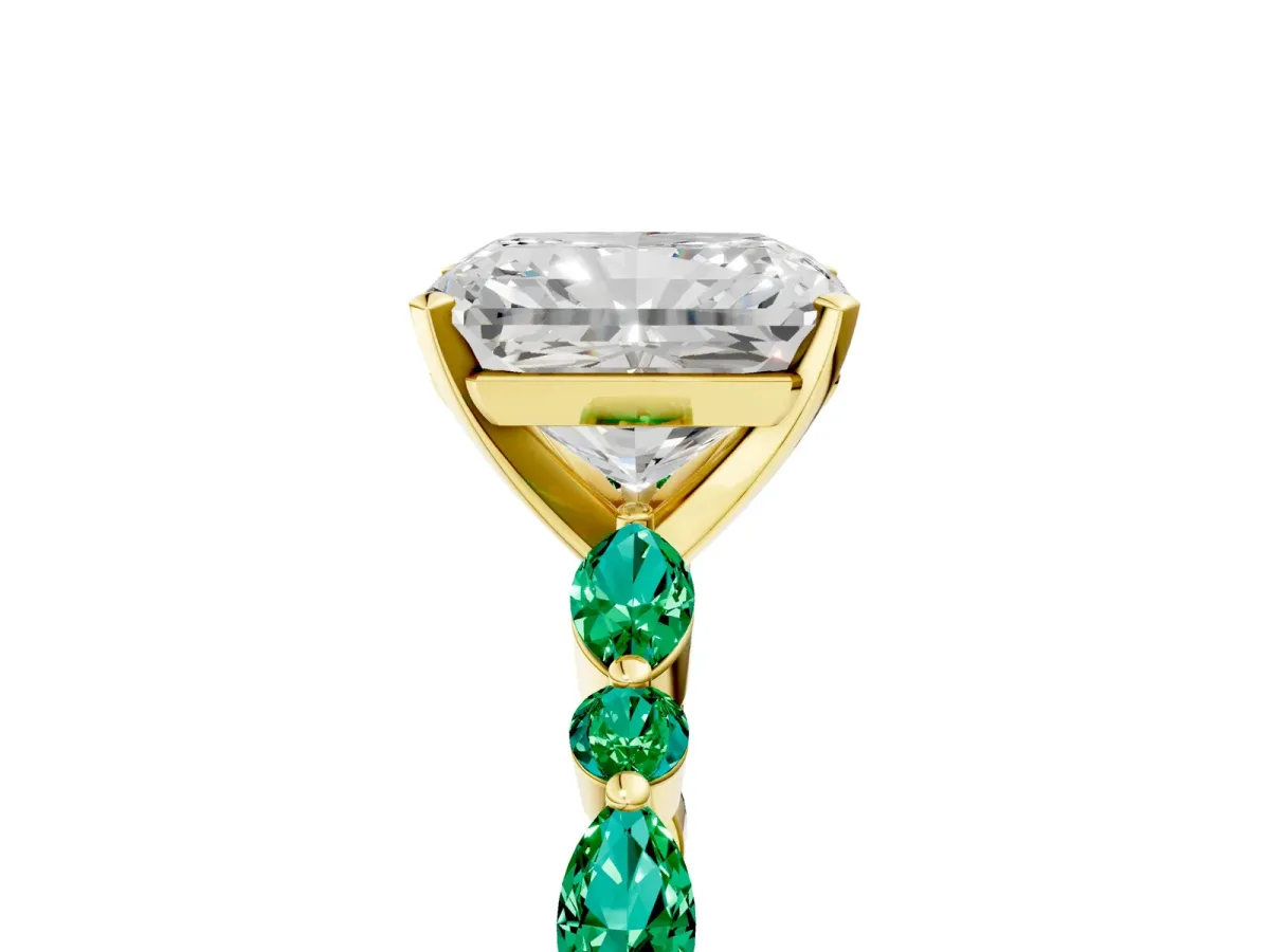 Radiant Cut Diamond Ring with Marquise and Round Emerald Side Stones and Four-Prong Setting Yellow gold
