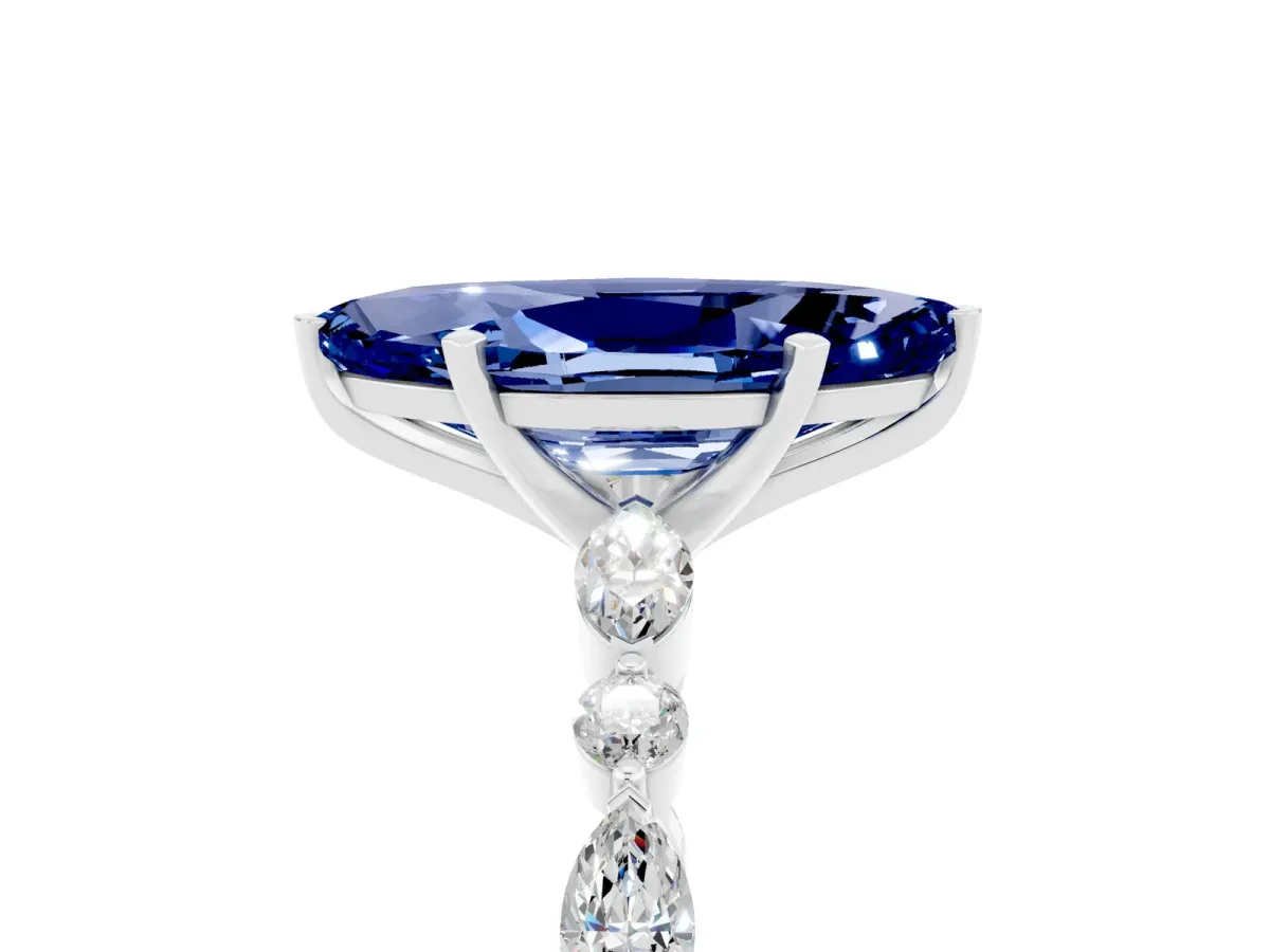 Marquise Cut Blue Sapphire Ring with Marquise and Round Side Stones and Four-Prong Setting White gold