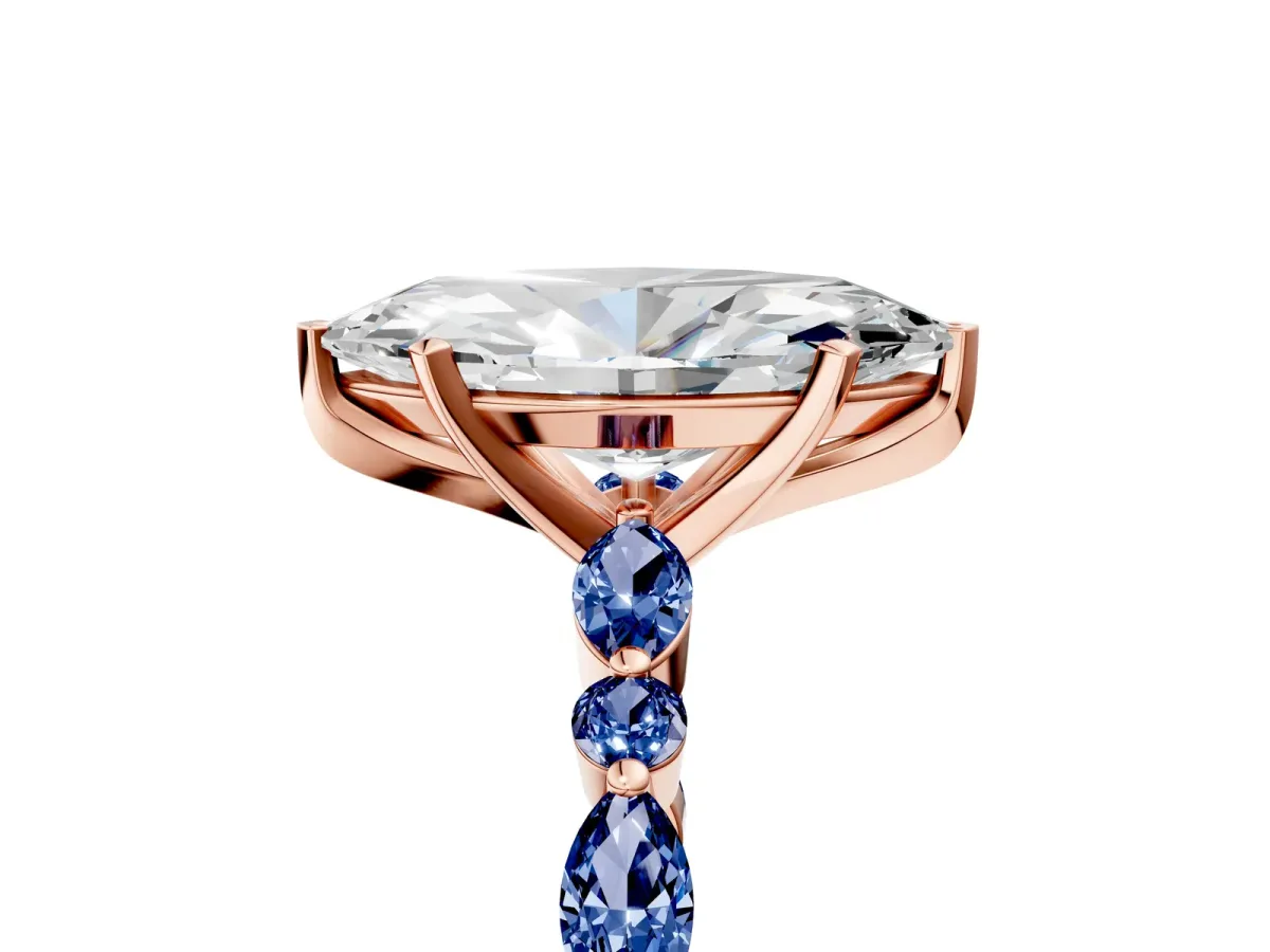 Marquise Cut Diamond Ring with Marquise and Round Blue Sapphire Side Stones and Four-Prong Setting Rose gold