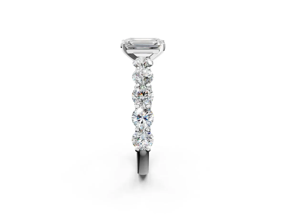 Emerald Cut Diamond Prong Setting with Side Stones on a Pave Band Silver