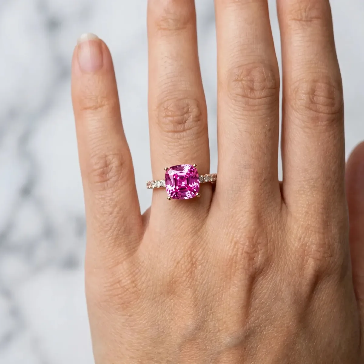 Cushion Cut Pink Sapphire Solitaire Ring with Round Pavé Band and Four-Prong Setting Rose gold