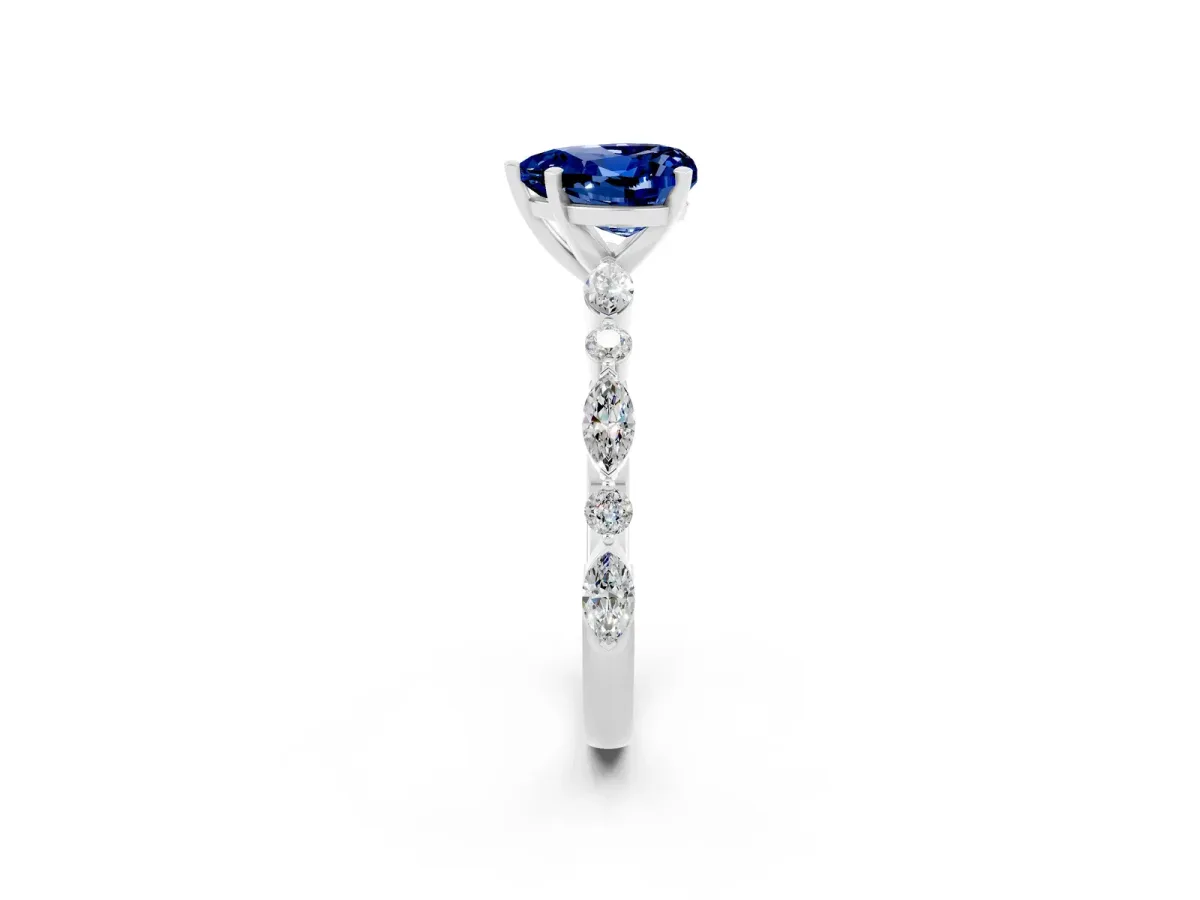 Heart Cut Blue Sapphire Ring with Marquise and Round Side Stones and Four-Prong Setting White gold