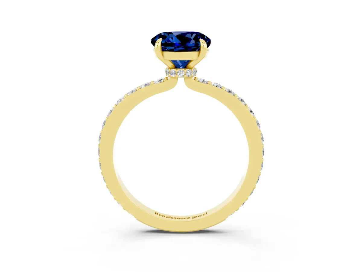 Round Cut Blue Sapphire Solitaire Engagement Ring with Pavé Band and Four-Prong Setting Yellow gold