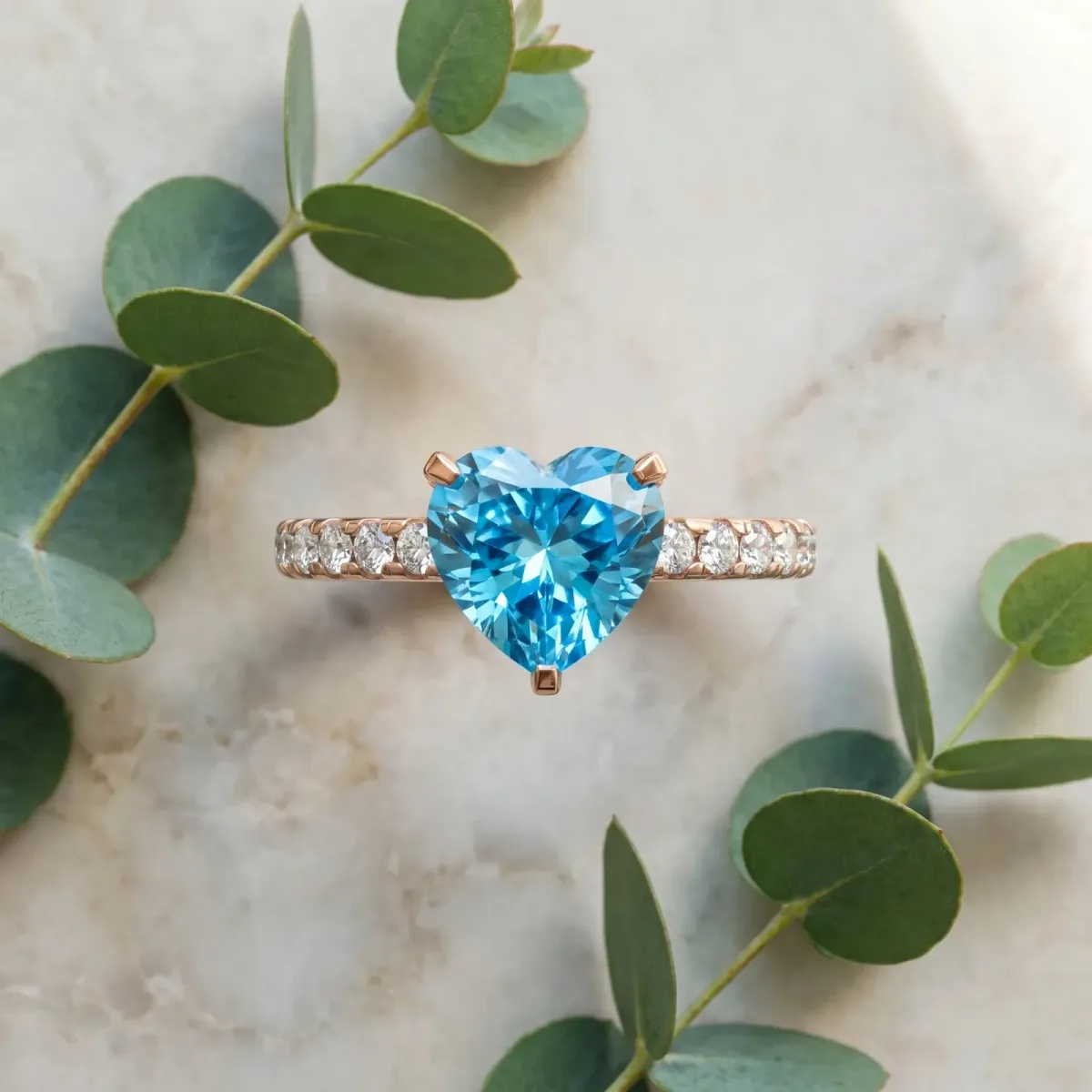 Heart Cut Blue Topaz Solitaire Ring with Round Pavé Band and Four-Prong Setting Rose gold