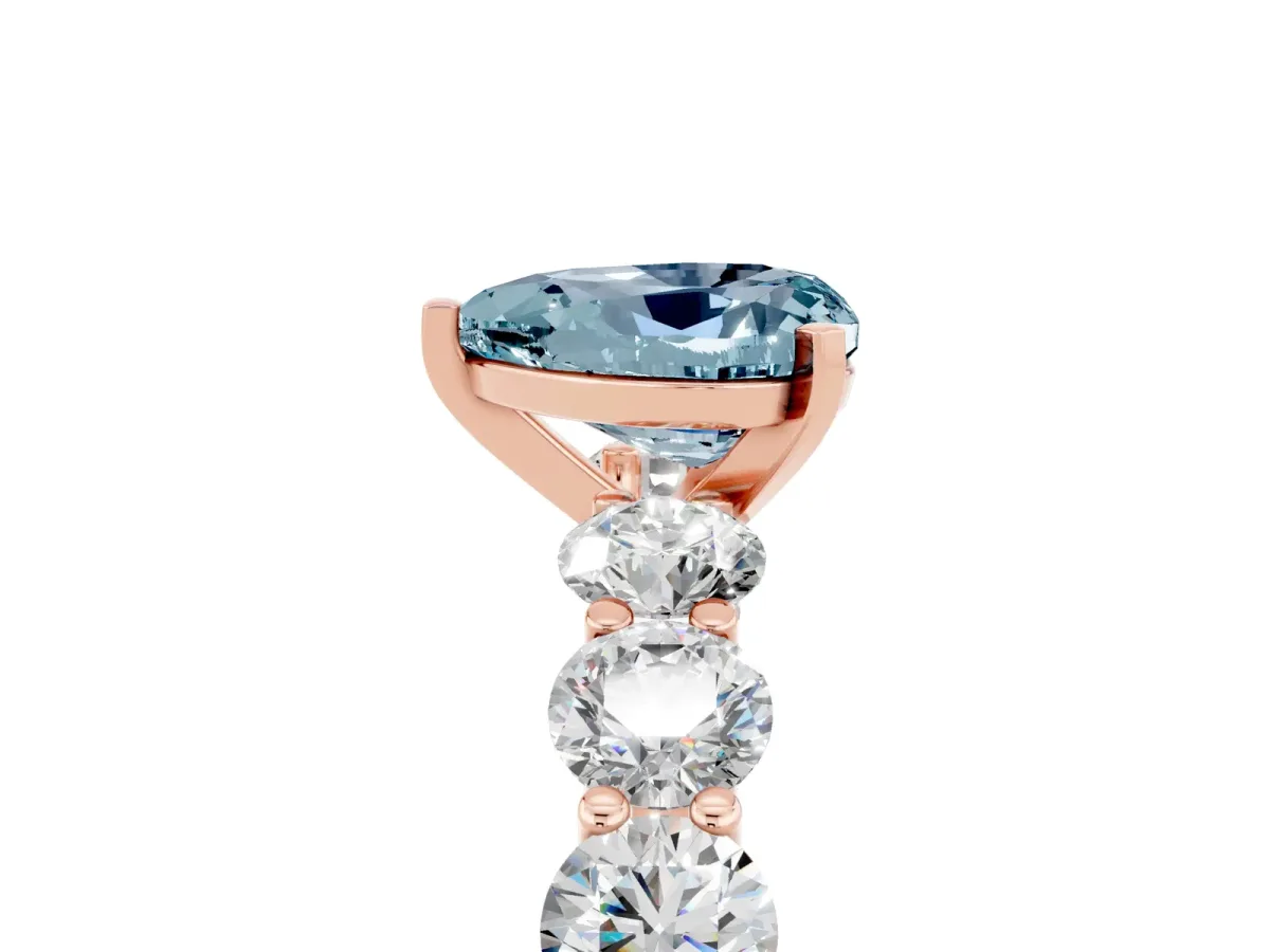 Heart Cut Aquamarine Prong Setting with Side Stones on a Pave Band Rose gold