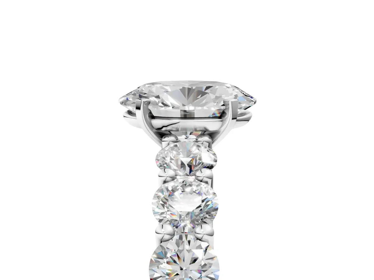 Oval Cut Diamond Prong Setting with Side Stones on a Pave Band Silver