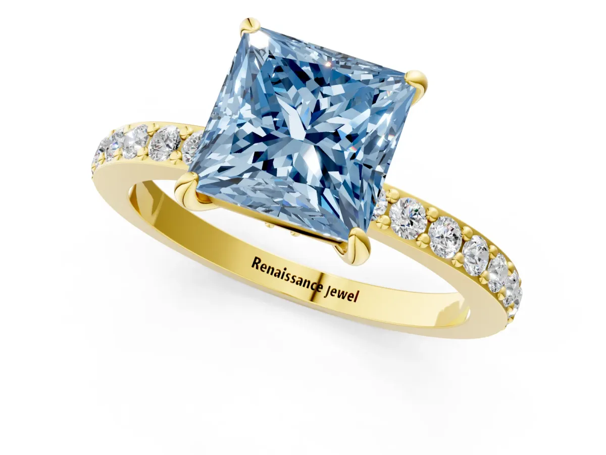 Fancy Blue Princess Cut Diamond Solitaire Engagement Ring with Pavé Band and Four-Prong Setting Yellow gold
