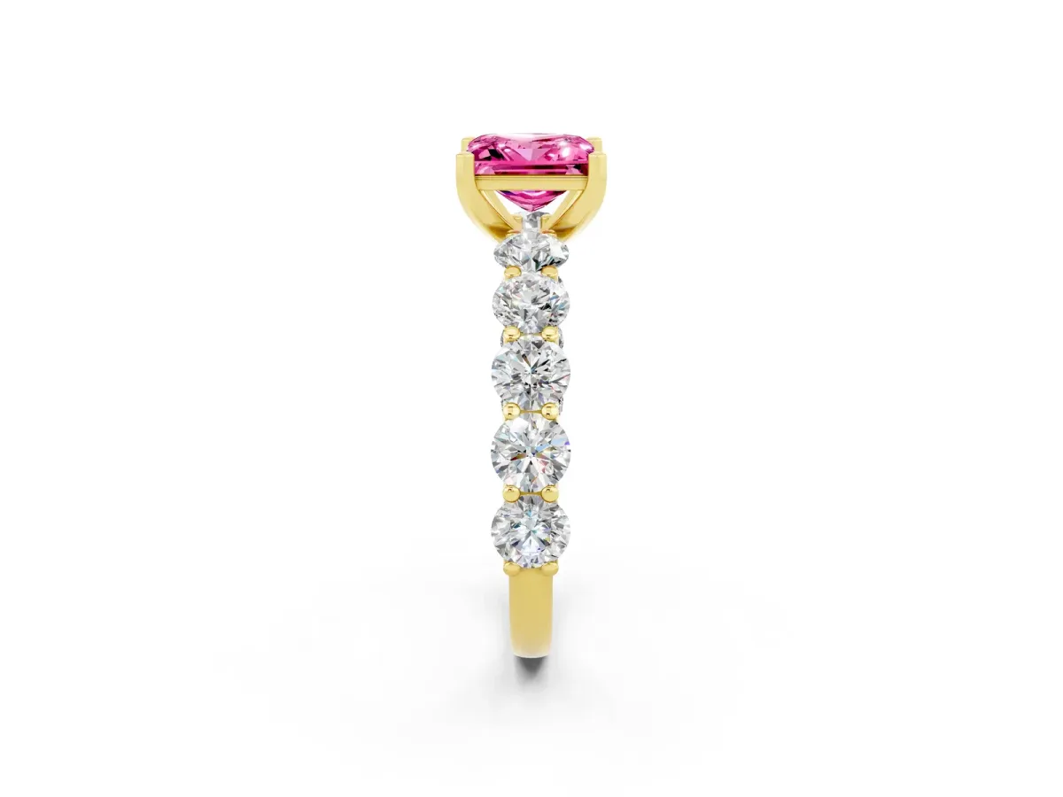 Princess Cut Pink Sapphire Prong Setting with Side Stones on a Pave Band Yellow gold