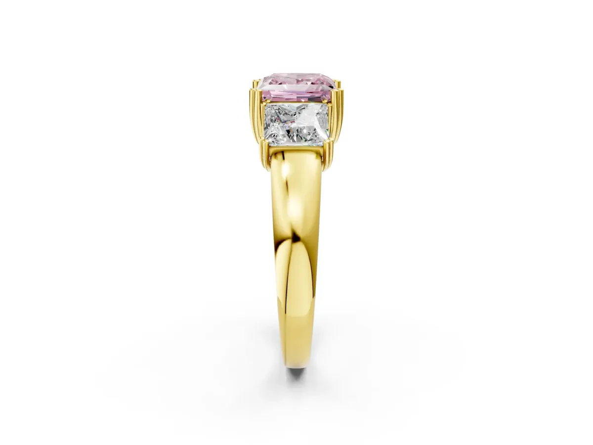 Fancy Pink Three-Stone Princess Cut Cut Diamond Ring with Channel Set Band and Four-Prong Setting Yellow gold