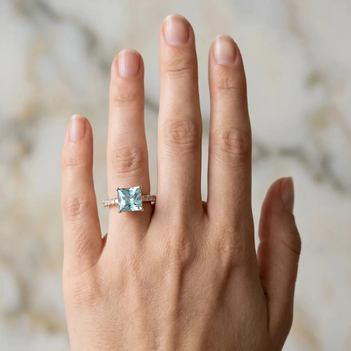 Princess Cut Aquamarine Solitaire Ring with Round Pavé Band and Four-Prong Setting Rose gold