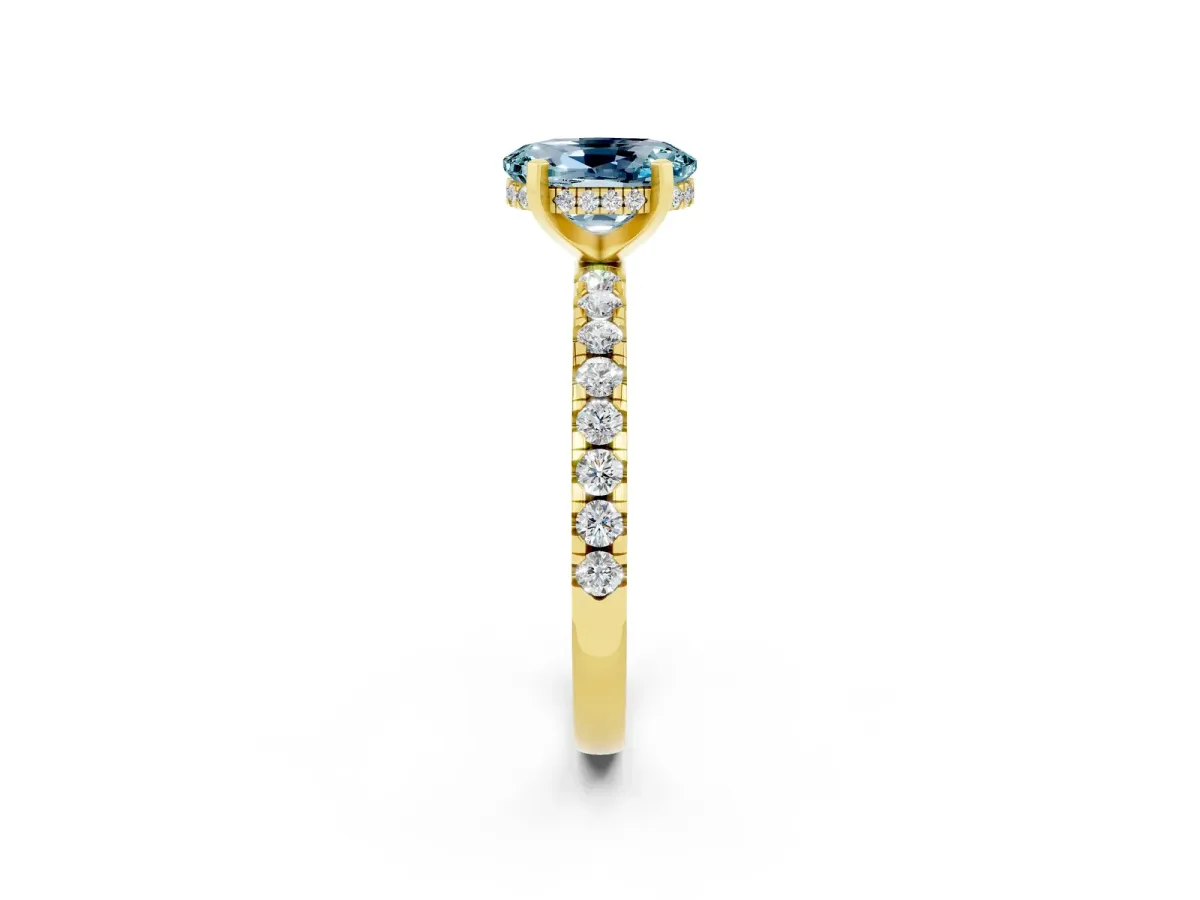 Oval Cut Aquamarine Solitaire Ring with Round Pavé Band and Four-Prong Setting Yellow gold