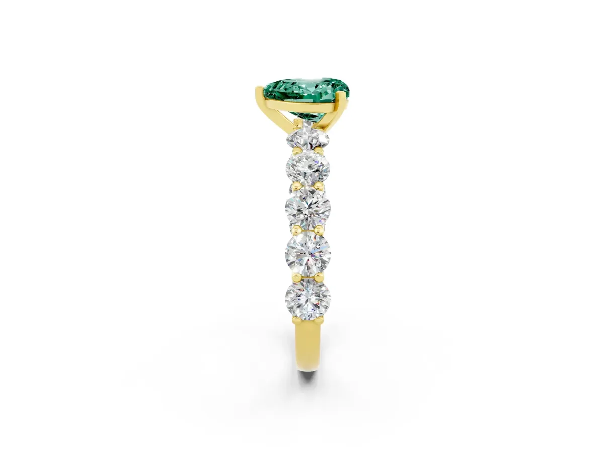 Heart Cut Green Sapphire Prong Setting with Side Stones on a Pave Band Yellow gold