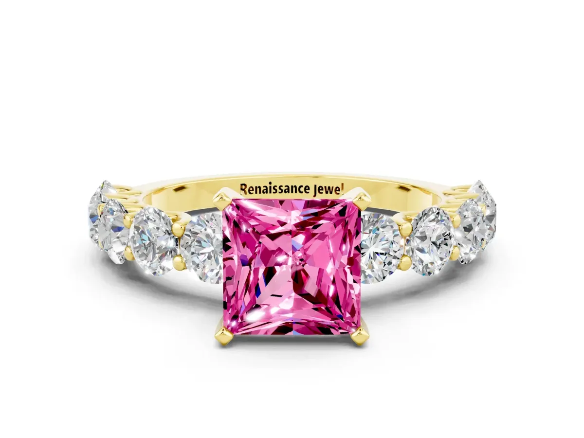 Princess Cut Pink Sapphire Prong Setting with Side Stones on a Pave Band Yellow gold
