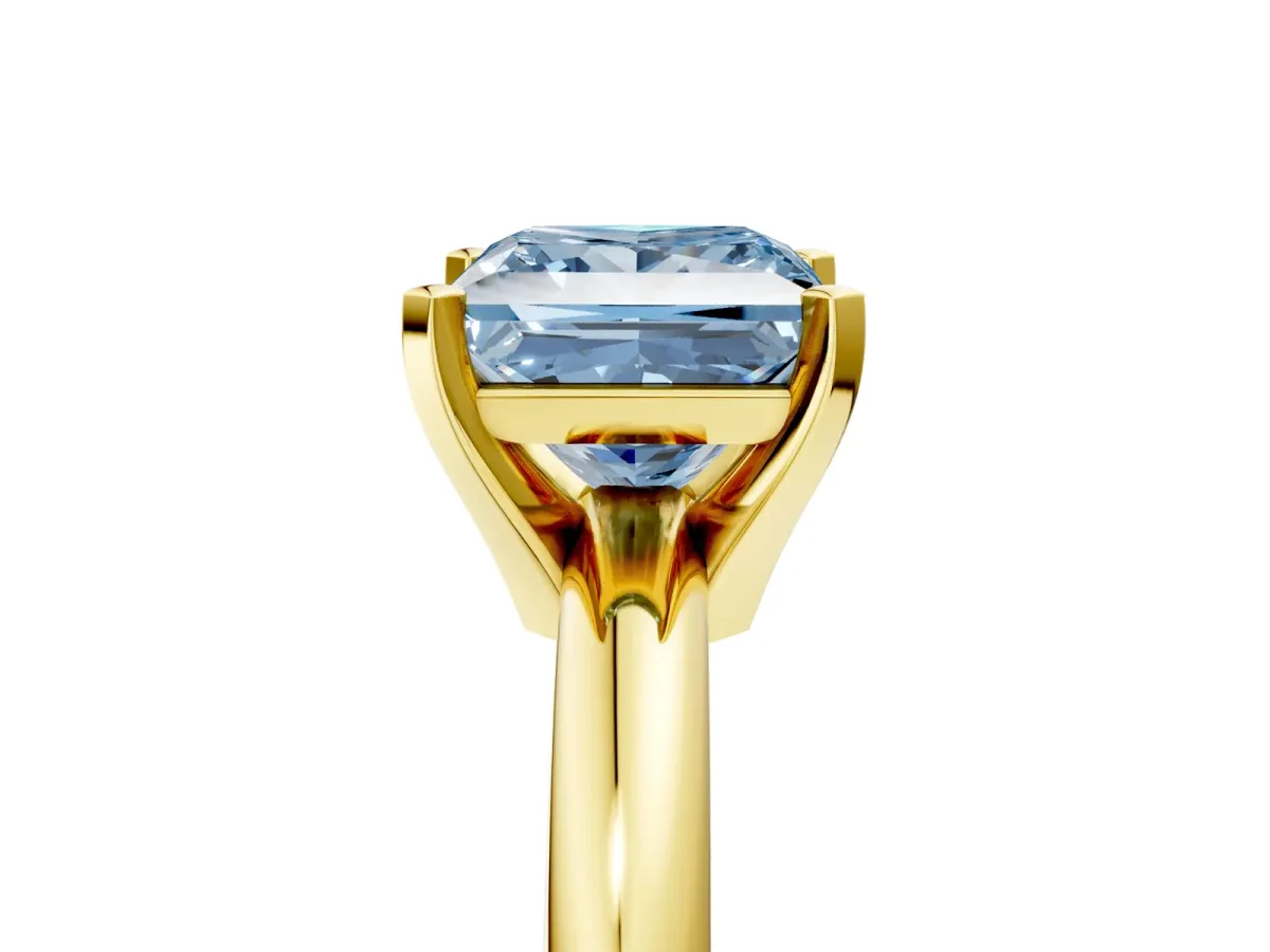 Fancy Blue Princess Cut Diamond Solitaire Engagement Ring with Round Band and Four-Prong Setting Yellow gold