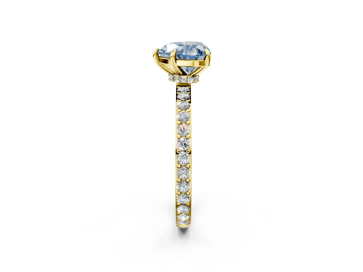 Fancy Blue Heart Cut Diamond Solitaire Engagement Ring with Pavé Band and Four-Prong Setting Yellow gold