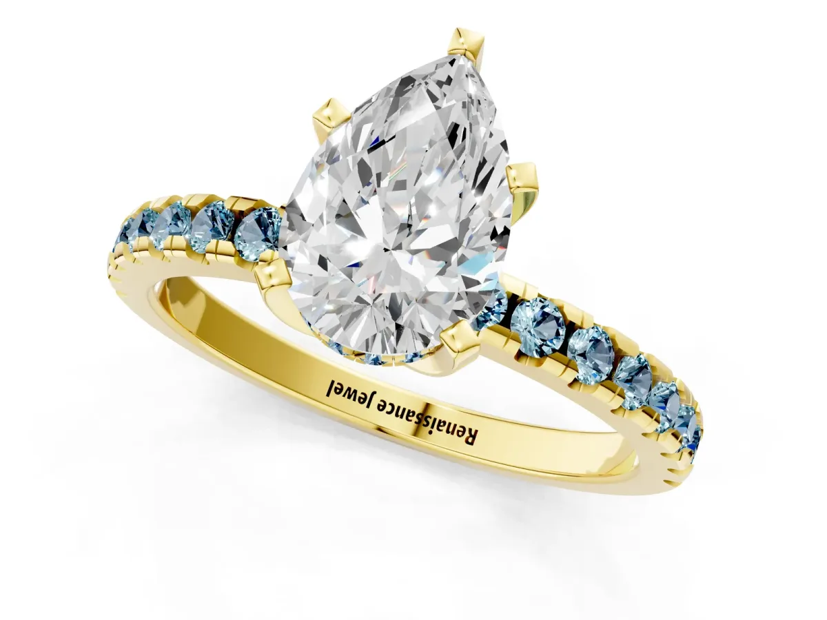 Pear Cut Diamond Solitaire Ring with Round Aquamarine Pavé Band and Four-Prong Setting Yellow gold