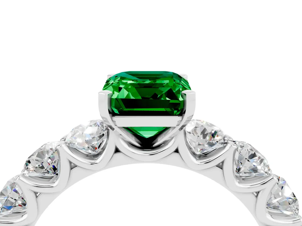 Emerald Cut Emerald Prong Setting with Side Stones on a Pave Band Silver