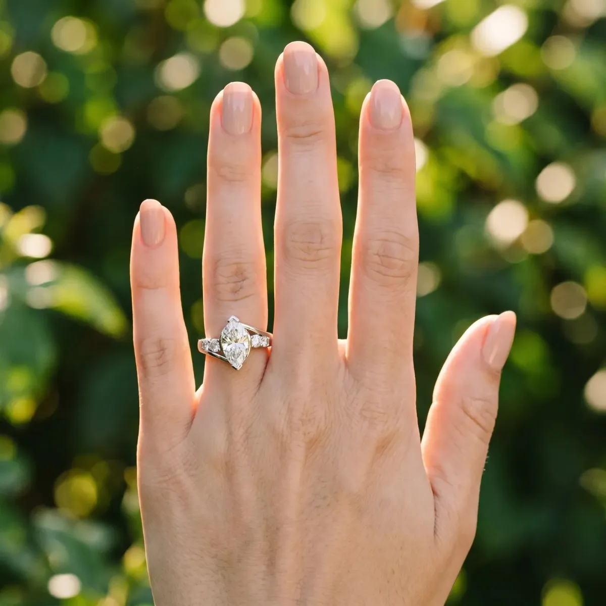 Bezel Set Marquise Cut Diamond Bypass Ring with Round Accents Platinum