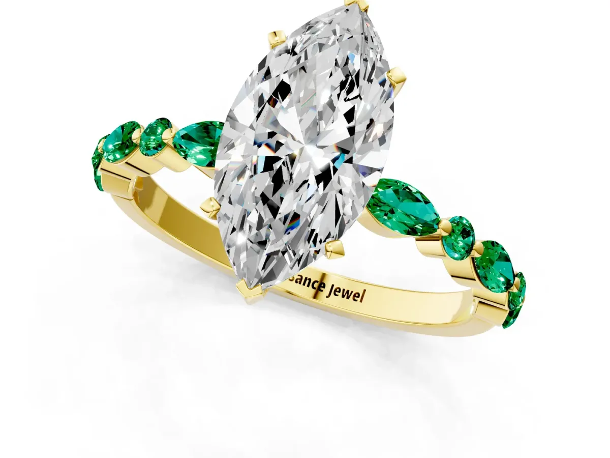 Marquise Cut Diamond Ring with Marquise and Round Emerald Side Stones and Four-Prong Setting Yellow gold