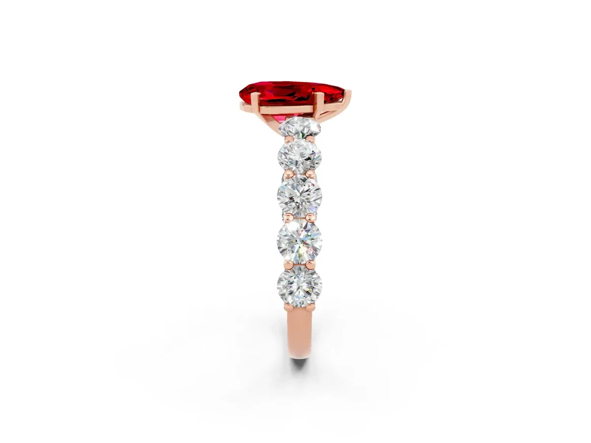 Pear Cut Ruby Prong Setting with Side Stones on a Pave Band Rose gold