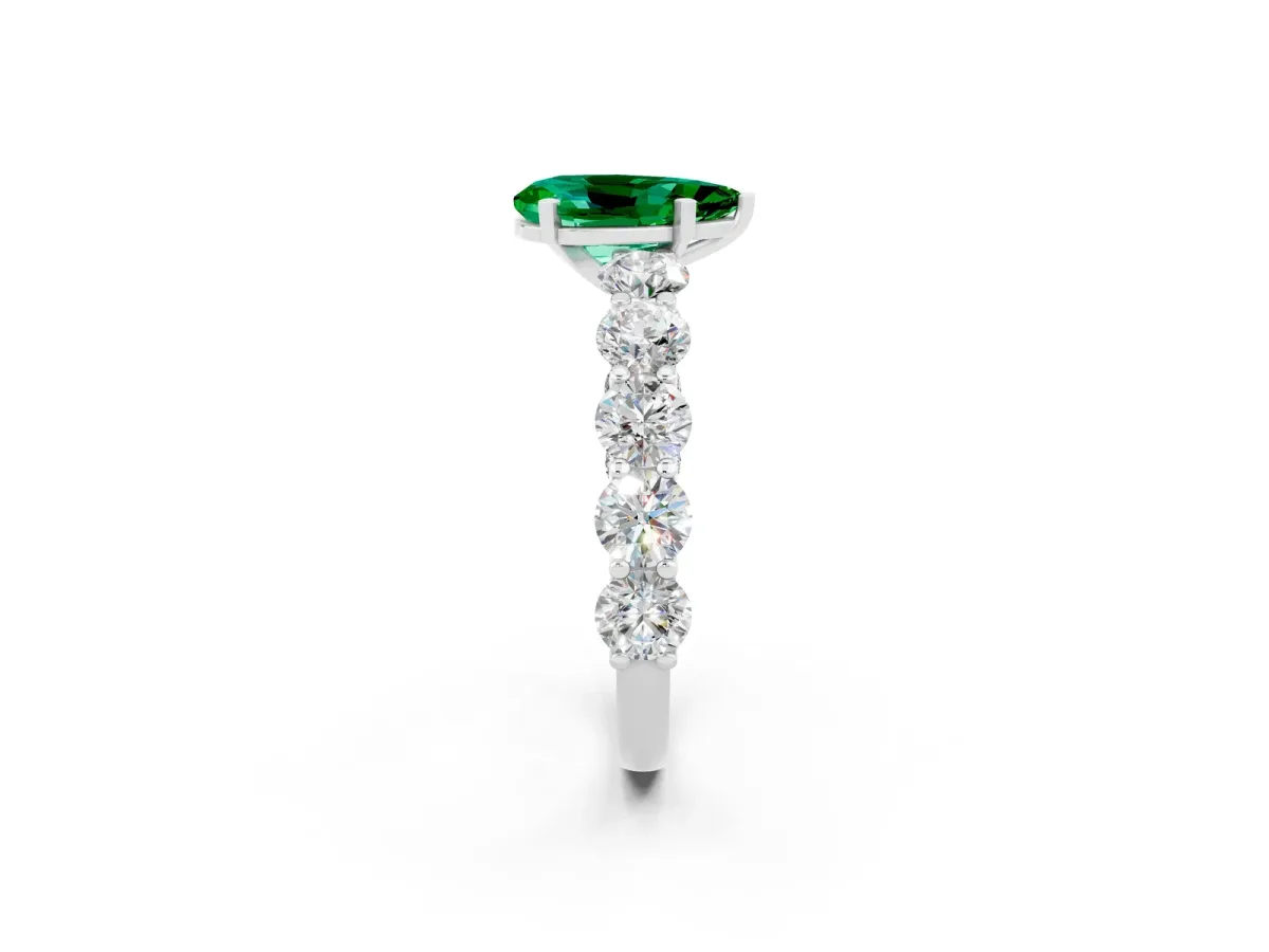 Pear Cut Emerald Prong Setting with Side Stones on a Pave Band Platinum