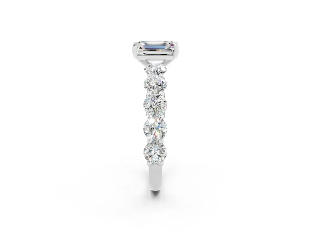 Emerald Cut Moissanite Prong Setting with Side Stones on a Pave Band Silver