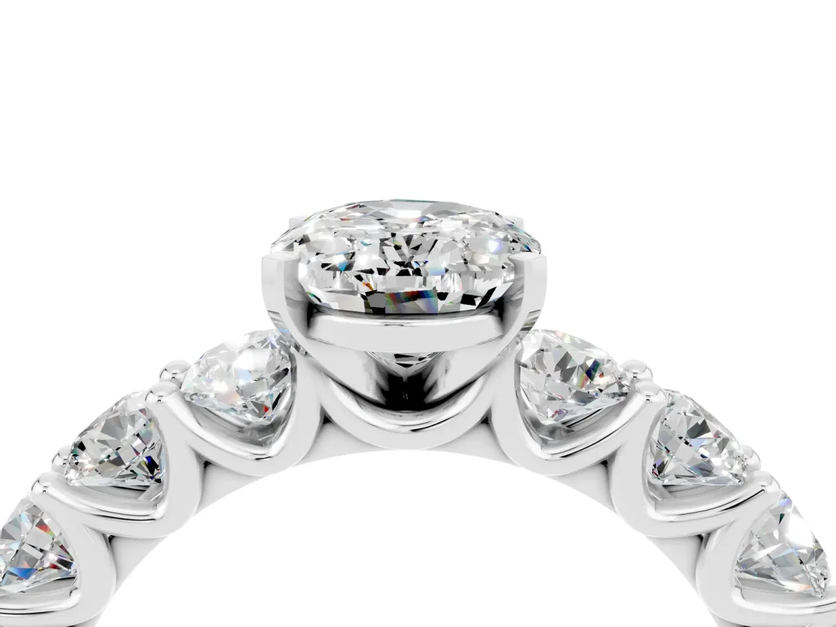 Oval Cut Moissanite Prong Setting with Side Stones on a Pave Band Silver