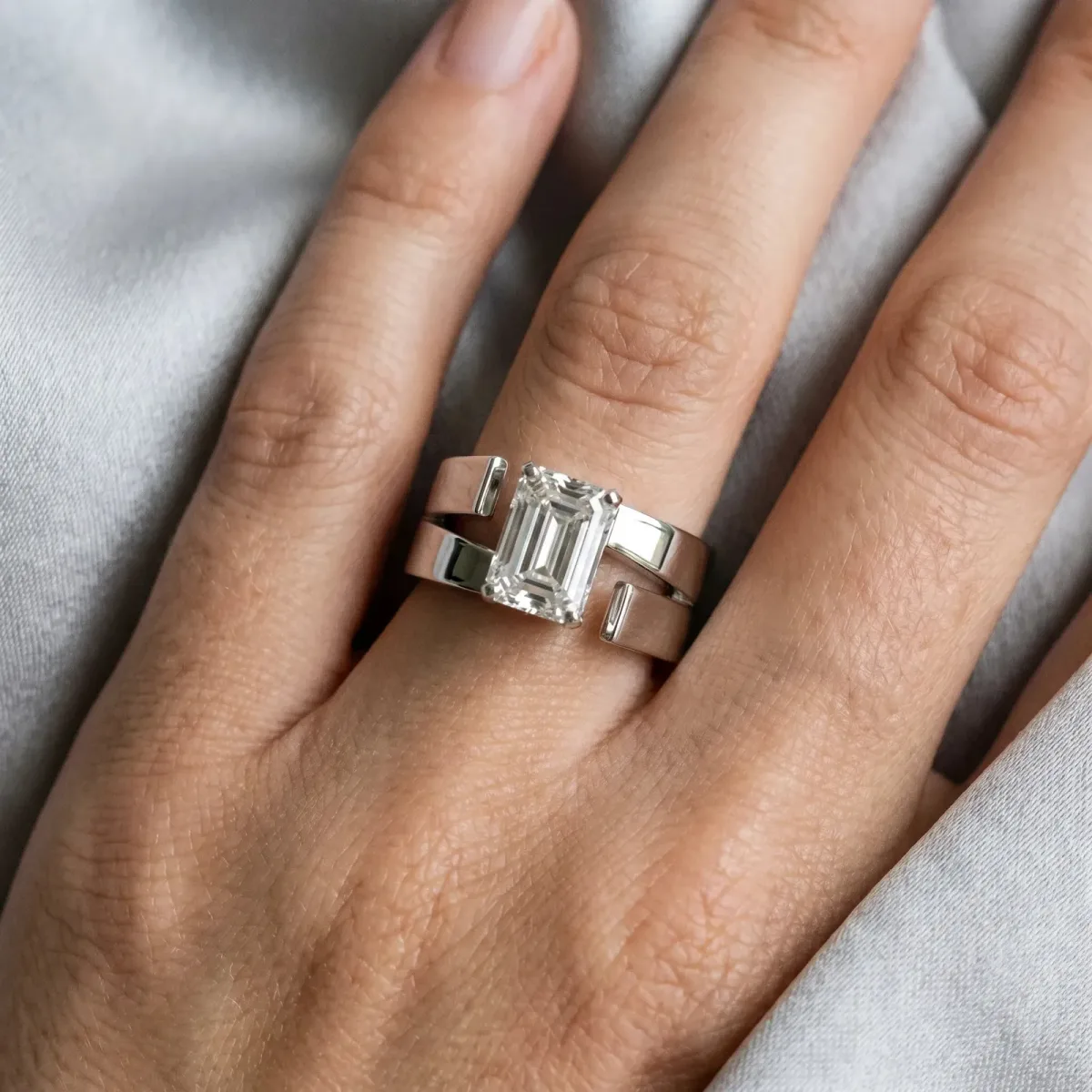 Modern Tension Set Emerald Cut Diamond Solitaire Wide Band Ring Platinum