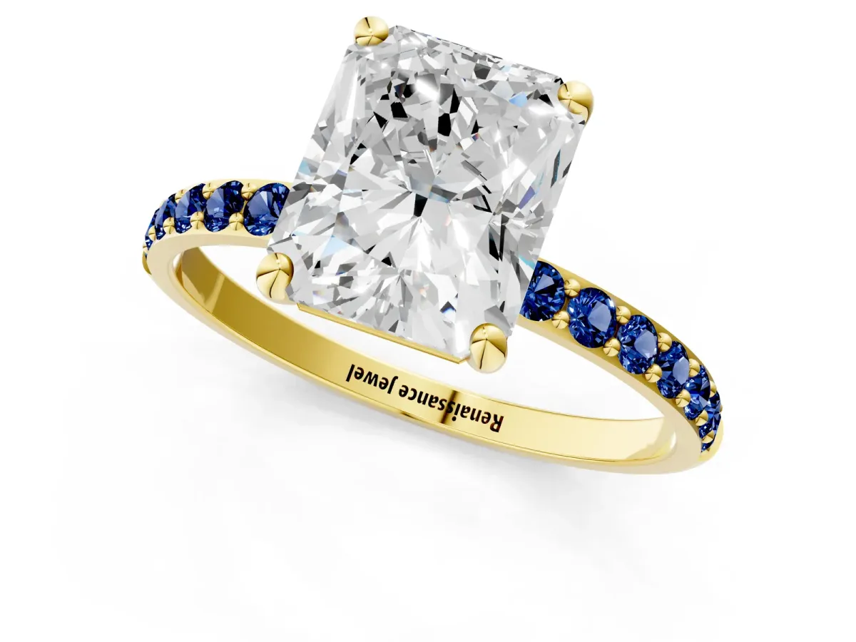 Radiant Cut Diamond Solitaire Ring with Round Blue Sapphire Pavé Band and Prong Setting Yellow gold