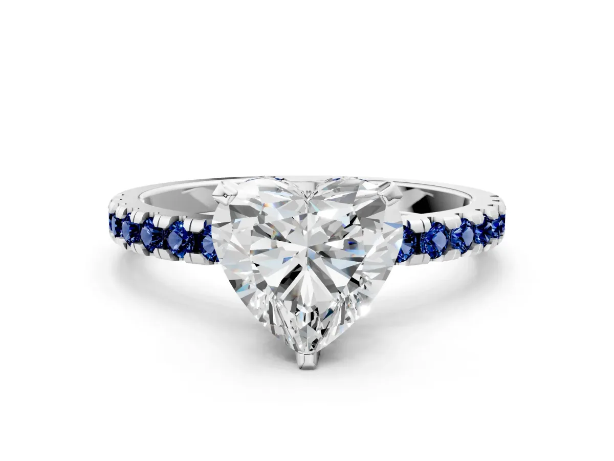 Heart Cut Diamond Solitaire Ring with Round Blue Sapphire Pavé Band and Four-Prong Setting White gold