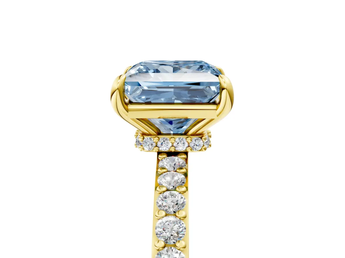 Fancy Blue Princess Cut Diamond Solitaire Engagement Ring with Pavé Band and Four-Prong Setting Yellow gold