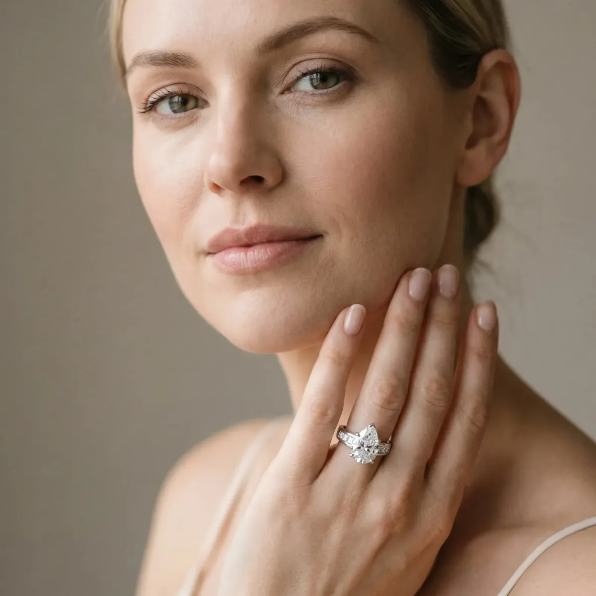 Pear Cut Cut Channel Set Solitaire Ring with Four-Prong Setting White gold